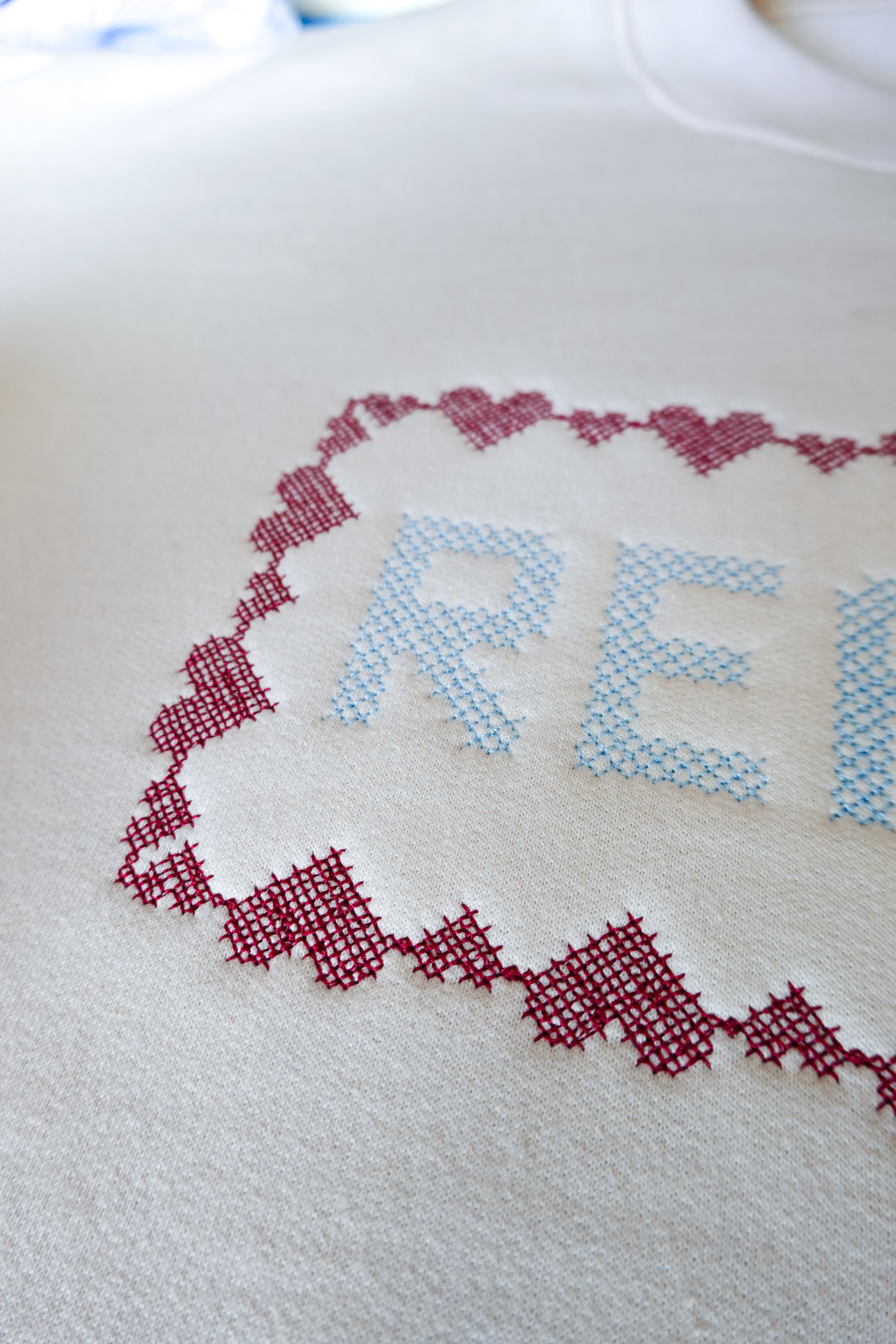 Reader Cross-Stitch Embroidered Crewneck