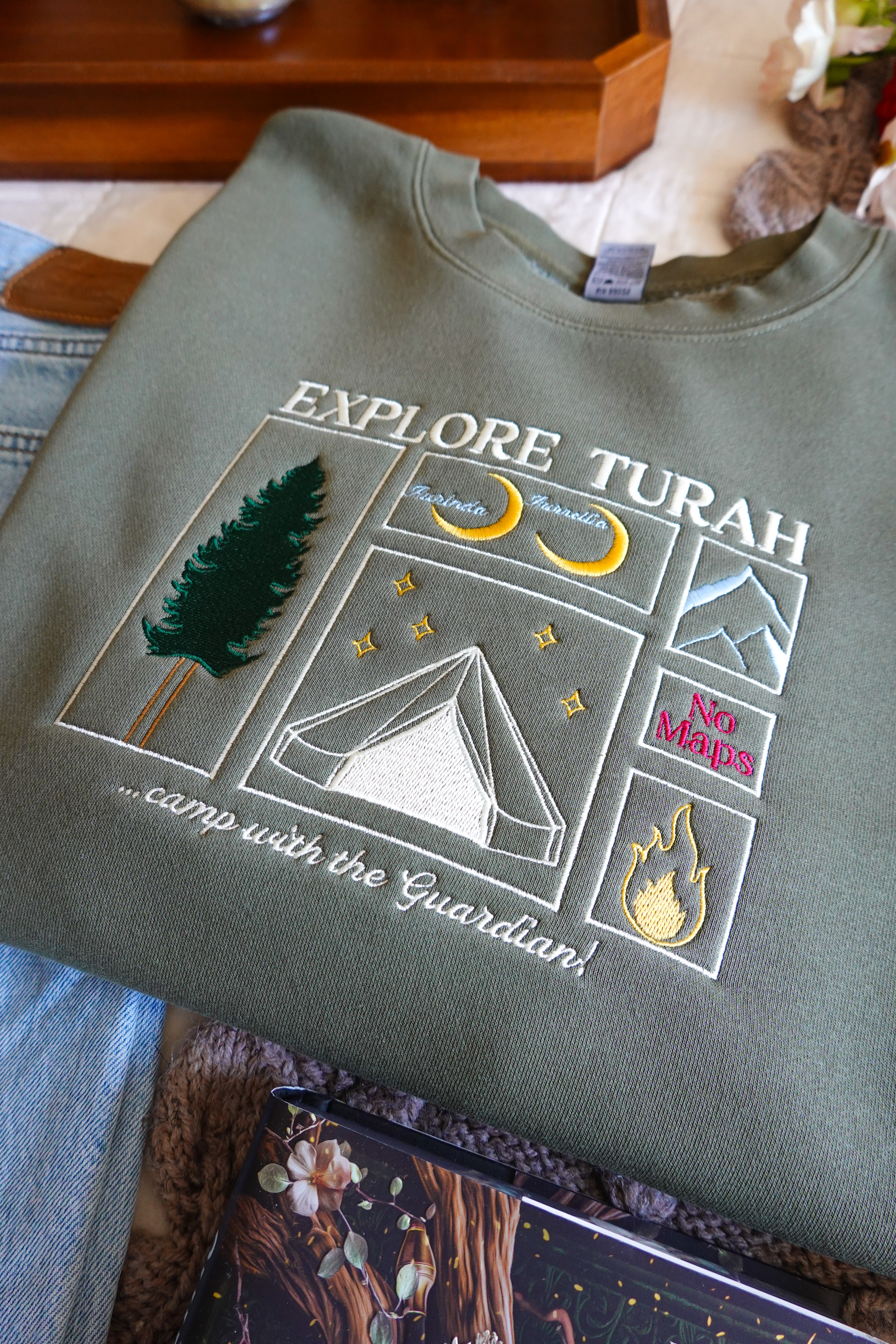 Explore Turah Embroidered Crewneck (Shield of Sparrows)