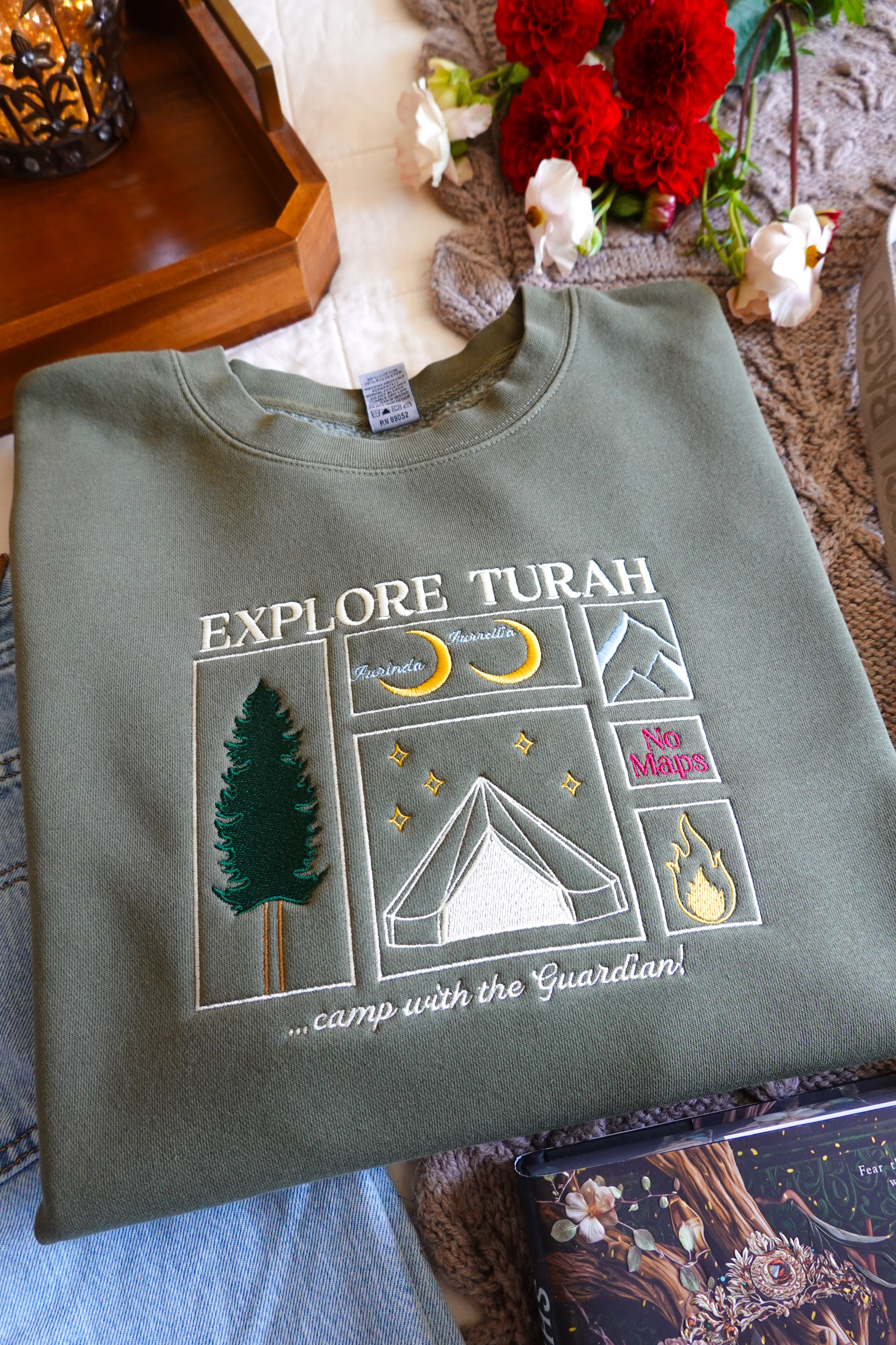Explore Turah Embroidered Crewneck (Shield of Sparrows)