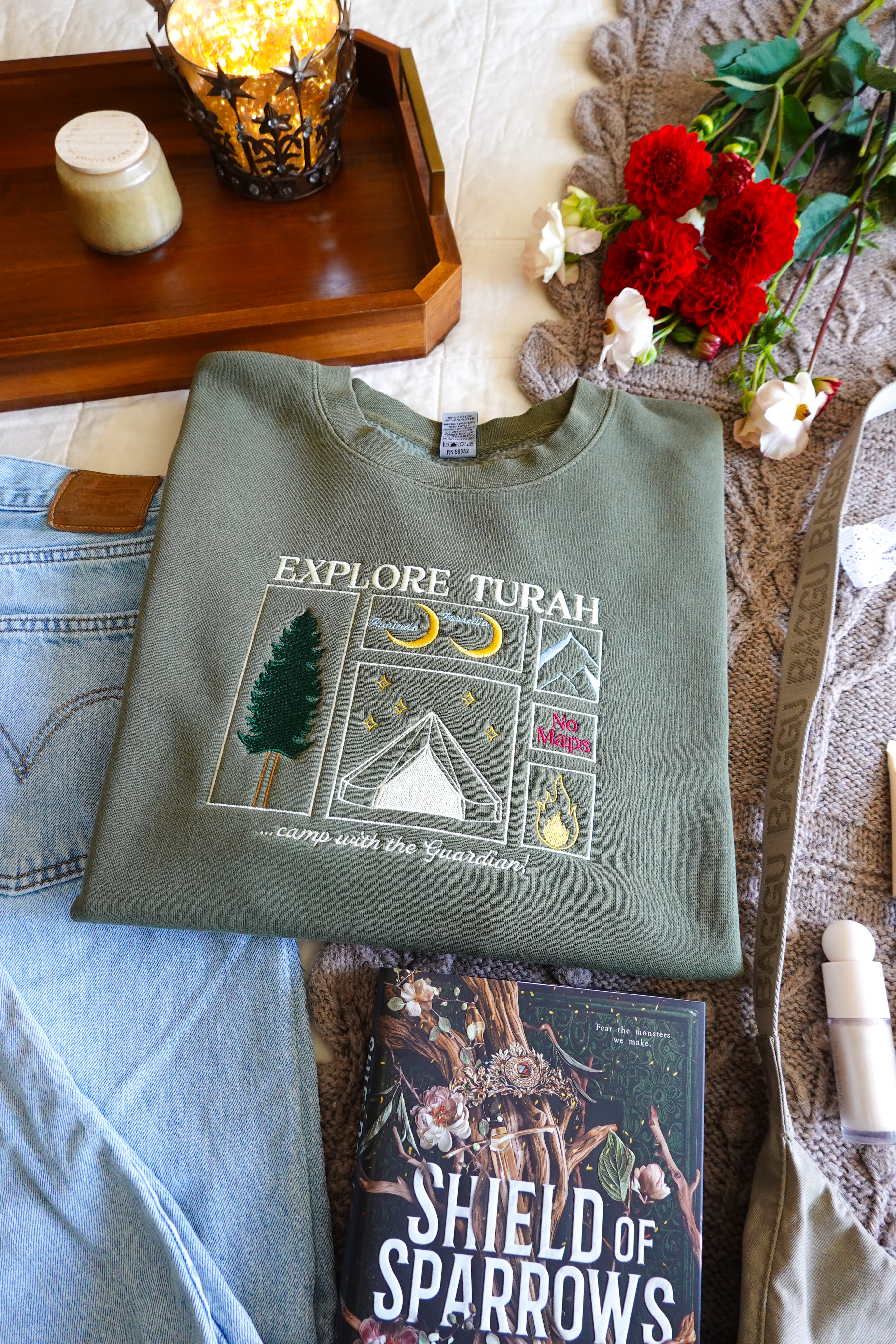 Explore Turah Embroidered Crewneck (Shield of Sparrows)
